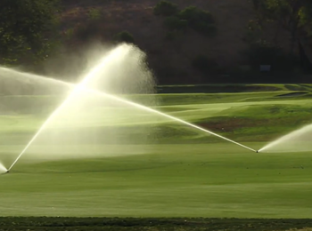 Hunter TTS800 golf rotors spraying a golf course