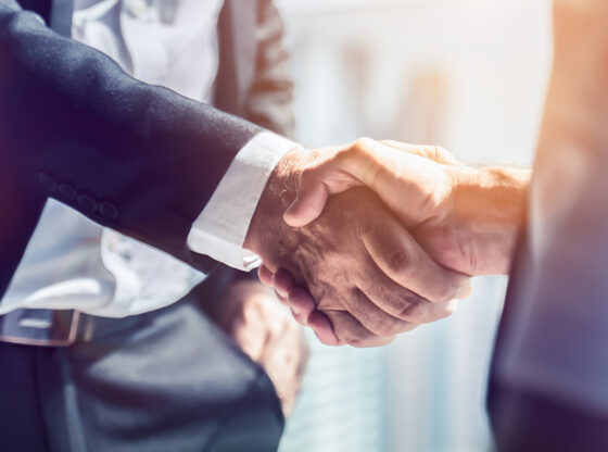 This is a picture of two business men shaking hands symbolizing the value they have for their place of work.