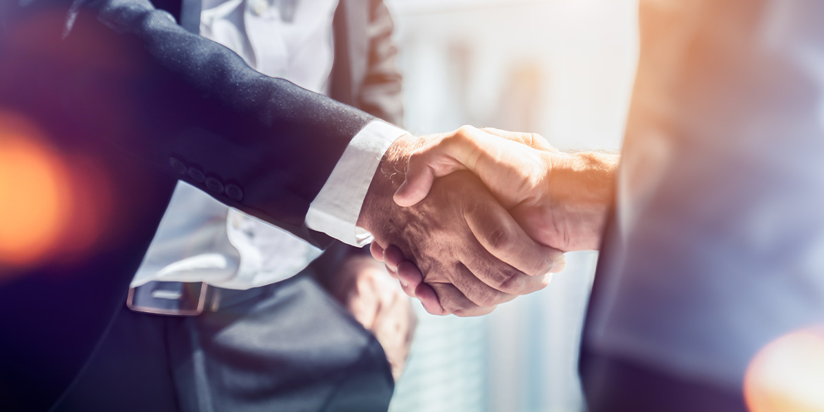 This is a picture of two business men shaking hands symbolizing the value they have for their place of work.